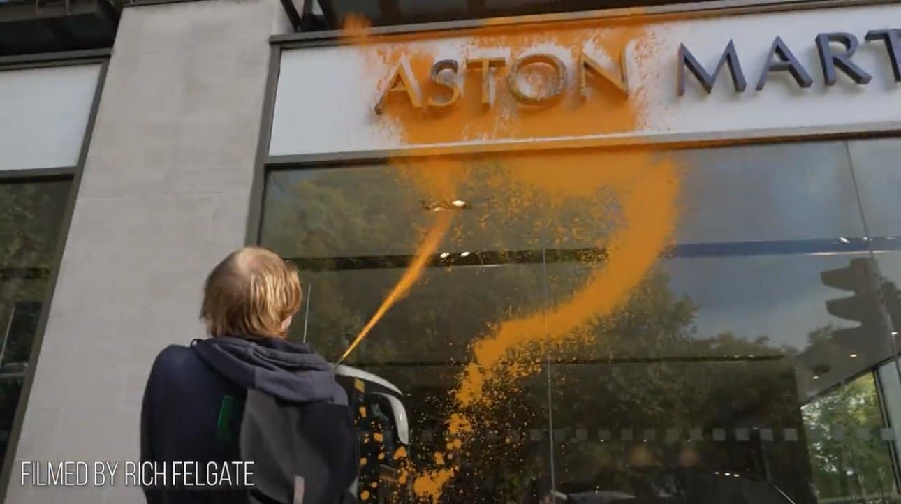 Unhinged Climate Activist Vandalizes Luxury Car Aston Martin Dealership